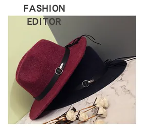 Detail of wool fedora hats featuring leather bands with silver ring buckles and tassels