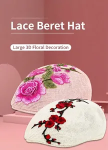 Detail of knitted beret hats with exquisite 3D floral embroidery in soft pink and cream