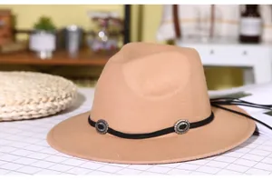 Detail of camel wool fedora hat featuring retro silver metal ornaments on black rope band
