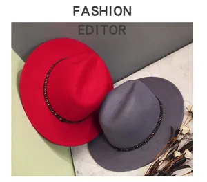 Detail of wool fedora hat featuring a black leather band and silver square metal studs