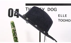 Detailed texture of dark grey wool felt hat with vintage silver metal studs on leather band