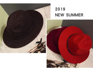 Detail of beaded decorative band on elegant wool fedora hat with fine texture