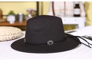 Detail of wool fedora hat with metal concho band and fringe in high-quality lifestyle setting