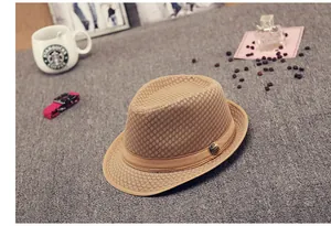 Detail of khaki mesh sun hat showing breathable hollow weave and vintage metal buckle