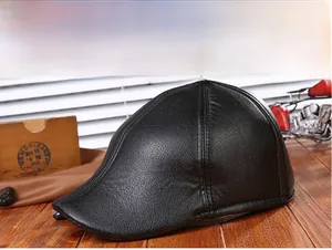 Close-up of black PU leather flat cap with lychee texture on retro wooden background