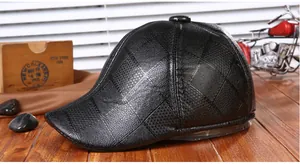 Close-up of black PU leather flat cap with diamond lattice texture and visor detail