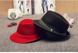 Detailed view of breathable mesh texture and metal crest on stylish summer trilby hats