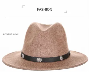 Detail of wool fedora hat with black leather band and vintage silver buckle