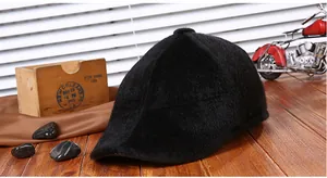 Detailed view of the soft black plush material and stitched crown of this warm winter hat
