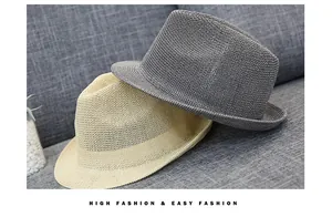 Close-up of woven fedora hats in beige and dark grey with breathable textured patterns
