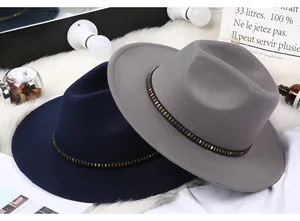 Detail of wool fedora hats featuring stylish leather bands with bronze square studs