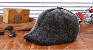 Detail view of winter men's faux fur ivy cap with warm plush texture on wooden table