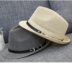 Detail of breathable hollow weave straw fedora hats with leather bands and gold buckles