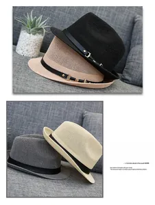 Detail of woven straw fedora hats in four colors with leather bands and gold buckles