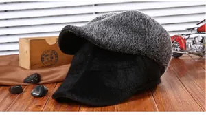 Close-up of winter flat cap with warm faux mink fur and premium black suede materials