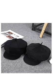 Classic black wool newsboy caps with vintage eight-panel structure and short brim