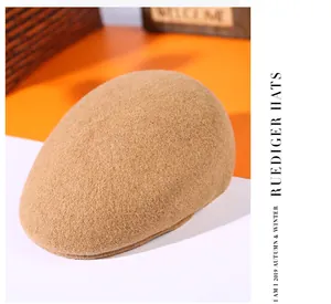 Close-up of wool flat cap in warm camel tone with soft textured finish for autumn