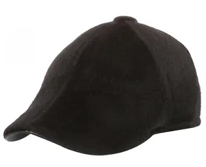 Detail view of the black plush velvet texture and round top button on the men's flat cap