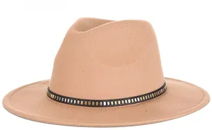 Detailed shot of khaki wool fedora hat featuring a black band with metallic square studs