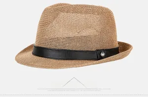 Detail of woven straw fedora hat featuring a black leather band and metal buckle