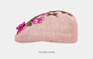 Detailed embroidery of pink flowers and green leaves on a breathable female beret hat