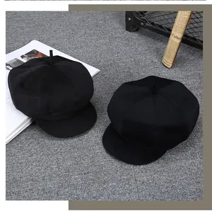 Close-up of thick cashmere newsboy caps for men with classic eight-panel wool texture