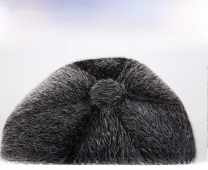 Detailed view of plush faux mink fur texture and structured top on gray men's flat cap