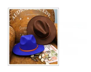 Close-up of wide brim wool fedora with brown leather band and metal buckle detail