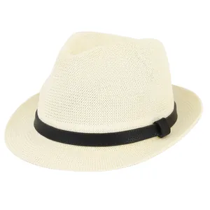 Detailed view of the woven texture and black leather strap on this straw fedora hat