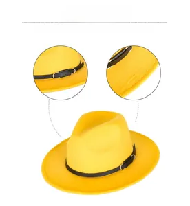 Detail view of the metal buckle and premium edge stitching on a yellow wool jazz fedora hat