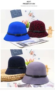 Detailed texture of assorted wool felt cloche hats with decorative leather straps