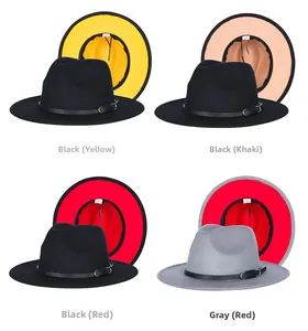 Detail view of four two-tone felt fedora hats with leather bands and metal buckles