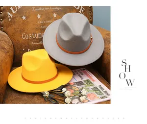 Detail of vintage felt jazz hat with stylish contrast colors and brown leather belt