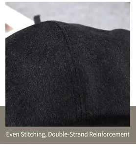 Detailed macro view of the reinforced double stitching on this wool cashmere flat cap