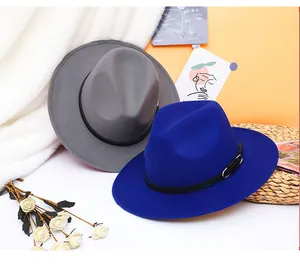 Detail of dark grey and royal blue wool fedora hats with black ribbon and metal buckle