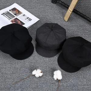 Classic men's vintage newsboy caps in black and dark grey wool for autumn and winter