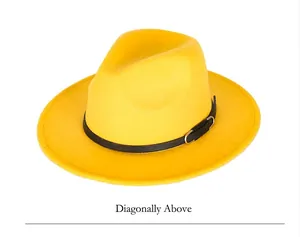 Detail of a bright yellow fedora hat showing its wool-like texture and black leather band