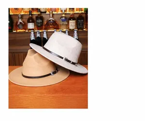 Detail of camel and off-white fedora hats with leather bands and vintage buckles
