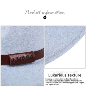 Detail of light blue wool fedora with brown PU leather LHASA embroidery band