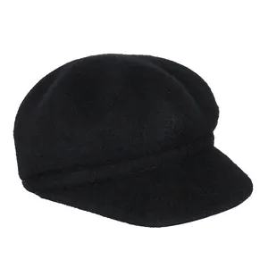 Classic black wool blend newsboy cap with a structured brim for a minimalist winter style