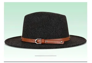 Detail of grey felt fedora featuring a brown leather band with metallic buckle and rivets