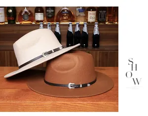 Detail of wide-brim fedora hats with leather bands and metal buckles on a bar background