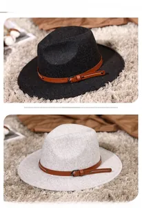 Close-up of wool fedora hats with brown leather belts and silver buckles details