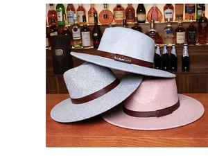 Detailed stack of grey and pink wide brim wool fedora hats with LHASA leather band
