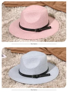 Detail of pink and blue felt fedoras featuring leather bands with silver metal buckles