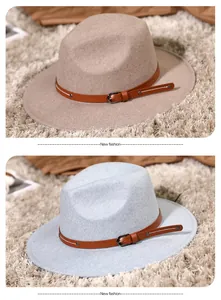 Detail of wool fedora hat featuring a leather band with metal buckles and studs