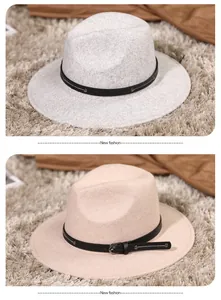 Close-up of dual-color wide brim fedora hats with leather belts and metal buckles