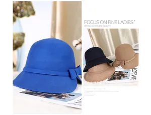 Detail view of wool felt cloche hats featuring elegant bow accents in multiple colors