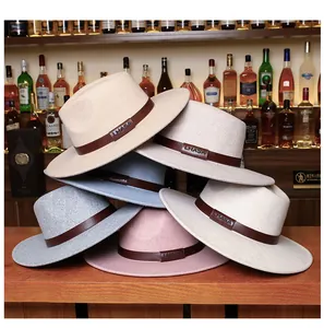 Stack of wide-brim felt fedora hats in multiple colors with LHASA leather bands