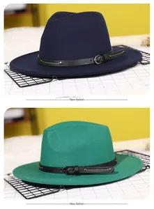 Detail of wide brim wool fedora hats with leather bands and metal buckles in green and blue